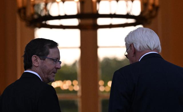 German President Frank-Walter Steinmeier (R) welcomes Israeli President Isaac Herzog for a gala dinner on May 12, 2025 at the Bellevue Palace in Berlin. Israeli President Isaac Herzog is visiting Germany to mark the 60th anniversary of diplomatic relations between the two countries. (Photo by RALF HIRSCHBERGER / AFP)