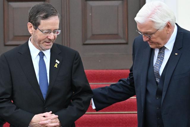 German President Frank-Walter Steinmeier (R) and Israeli President Isaac Herzog pose ahead a gala dinner on May 12, 2025 at the Bellevue Palace in Berlin. Israeli President Isaac Herzog is visiting Germany to mark the 60th anniversary of diplomatic relations between the two countries. (Photo by RALF HIRSCHBERGER / AFP)