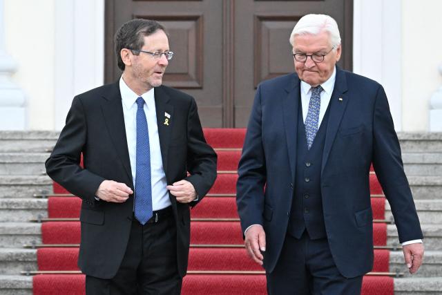 German President Frank-Walter Steinmeier (R) and Israeli President Isaac Herzog pose ahead a gala dinner on May 12, 2025 at the Bellevue Palace in Berlin. Israeli President Isaac Herzog is visiting Germany to mark the 60th anniversary of diplomatic relations between the two countries. (Photo by RALF HIRSCHBERGER / AFP)