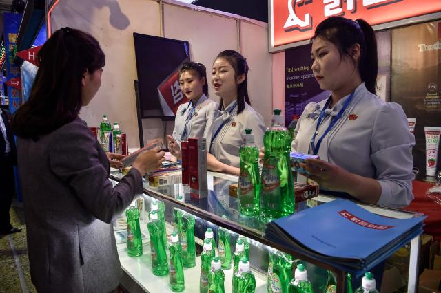A customer browses goods during the 23rd Pyongyang Spring International Trade Fair at the Central Youth Hall in Pyongyang on May 12, 2025. (Photo by KIM Won Jin / AFP)