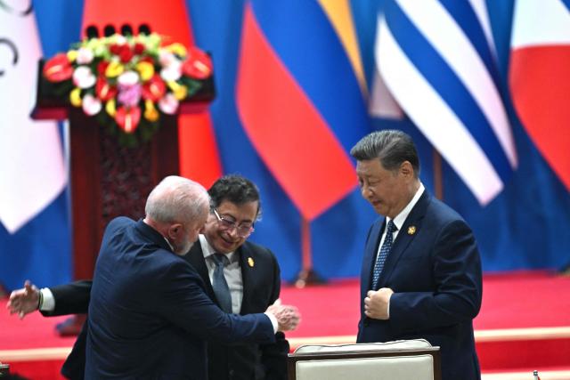 China’s President Xi Jinping (R), Colombia’s President Gustavo Petro (C) and Brazil’s President Luiz Inacio Lula da Silva attend the opening ceremony of the Fourth Ministerial Meeting of the Forum of China and Community of Latin American and Caribbean States (CELAC) in Beijing on May 13, 2025. (Photo by Pedro Pardo / AFP)