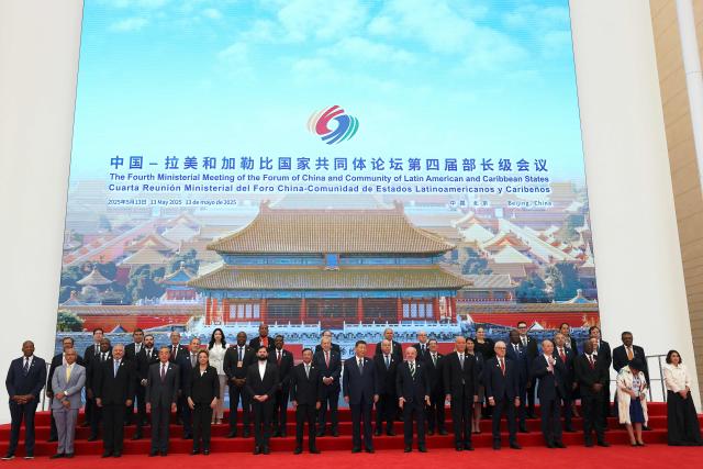 Chinese President Xi Jinping, Brazil President Luiz Inacio Lula da Silva, Chile President President Gabriel Boric, Colombia President Gustavo Petro and other CELAC representatives attend a group photo session before the opening ceremony of the Fourth Ministerial Meeting of the Forum of China and Community of Latin American and Caribbean States (CELAC) in Beijing on May 13, 2025. (Photo by FLORENCE LO / POOL / AFP)