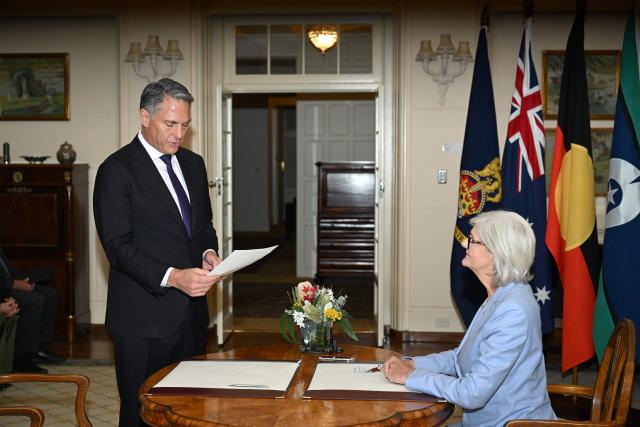 Australian Deputy Prime Minister Richard Marles (L) is sworn in by Australian Governor-General Sam Mostyn during a ceremony at Government House in Canberra on May 13, 2025. (Photo by Saeed Khan / AFP)