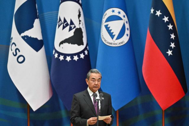 China’s Foreign Minister Wang Yi attends the opening ceremony of the Fourth Ministerial Meeting of the Forum of China and Community of Latin American and Caribbean States (CELAC), in Beijing on May 13, 2025. (Photo by Pedro PARDO / AFP)