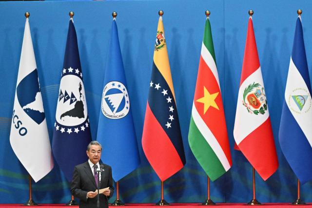 China’s Foreign Minister Wang Yi attends the opening ceremony of the Fourth Ministerial Meeting of the Forum of China and Community of Latin American and Caribbean States (CELAC), in Beijing on May 13, 2025. (Photo by Pedro PARDO / AFP)