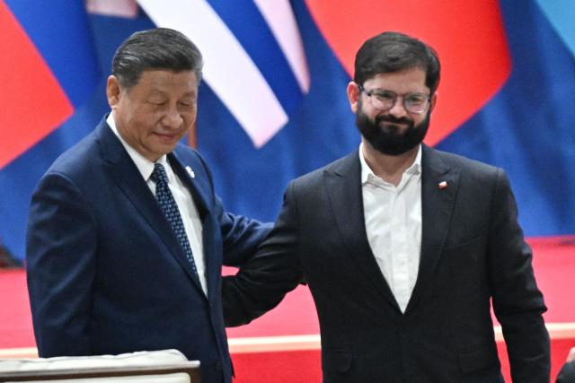 China’s President Xi Jinping (L) and Chile’s President Gabriel Boric attend the opening ceremony of the Fourth Ministerial Meeting of the Forum of China and Community of Latin American and Caribbean States (CELAC) in Beijing on May 13, 2025. (Photo by Pedro PARDO / AFP)