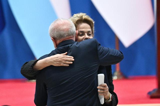 Brazil’s President Luiz Inacio Lula da Silva (L) and Dilma Rousseff, Chair of the New Development Bank and former president of Brazil, attend the opening ceremony of the Fourth Ministerial Meeting of the Forum of China and Community of Latin American and Caribbean States (CELAC) in Beijing on May 13, 2025. (Photo by Pedro PARDO / AFP)