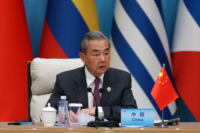 Chinese Foreign Minister Wang Yi speaks during the plenary session of the Fourth Ministerial Meeting of the Forum of China and Community of Latin American and Caribbean States (CELAC) in Beijing on May 13, 2025. (Photo by FLORENCE LO / POOL / AFP)