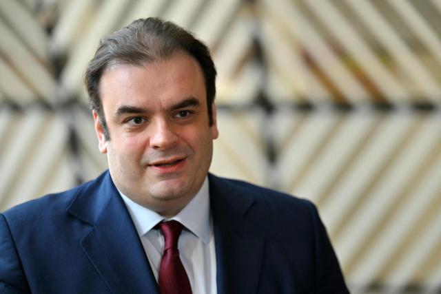 Greek Finance Minister Kyriakos Pierrakakis talks to the press upon his arrival for a European Union (EU) Economic and Financial Affairs Council (ECOFIN) at the European Council headquarters in Brussels on May 13, 2025. (Photo by NICOLAS TUCAT / AFP)