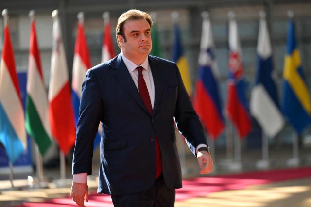 Greek Finance Minister Kyriakos Pierrakakis arrives for a European Union (EU) Economic and Financial Affairs Council (ECOFIN) at the European Council headquarters in Brussels on May 13, 2025. (Photo by NICOLAS TUCAT / AFP)