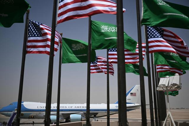 TOPSHOT - Air Force One lands at the tramac in Riyadh on May 13, 2025. (Photo by Brendan SMIALOWSKI / AFP)