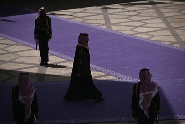 TOPSHOT - Saudi Crown Prince Mohammed bin Salman makes his way to greet US President upon his arrival in Riyadh on May 13, 2025. (Photo by Brendan SMIALOWSKI / AFP)