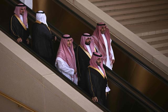 Saudi Crown Prince Mohammed bin Salman makes his way to greet US President upon his arrival in Riyadh on May 13, 2025. (Photo by Brendan SMIALOWSKI / AFP)