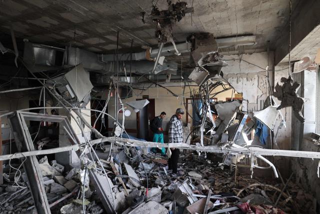 EDITORS NOTE: Graphic content / Palestinians inspect the destruction inside Nasser hospital in Khan Yunis in the southern Gaza Strip, following an Israeli strike early on May 13, 2025 in which Palestinian journalist Hassan Aslih was killed along with several others. The Israeli military said it struck a Gaza hospital "housing Hamas militants" in a raid on May 13 which, according to the Palestinian group, killed the journalist who had been wounded in an Israeli attack last month and a number of civilians. (Photo by Eyad BABA / AFP)