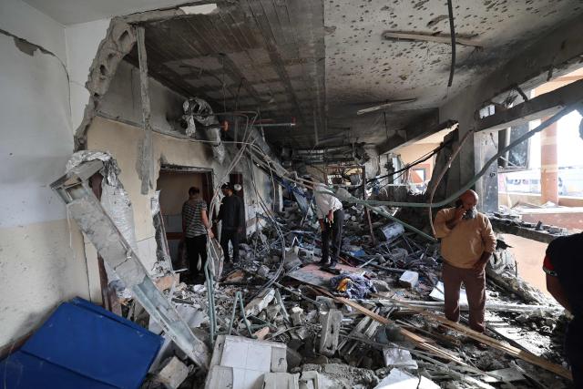 EDITORS NOTE: Graphic content / Palestinians inspect the destruction inside Nasser hospital in Khan Yunis in the southern Gaza Strip, following an Israeli strike early on May 13, 2025 in which Palestinian journalist Hassan Aslih was killed along with several others. The Israeli military said it struck a Gaza hospital "housing Hamas militants" in a raid on May 13 which, according to the Palestinian group, killed the journalist who had been wounded in an Israeli attack last month and a number of civilians. (Photo by Eyad BABA / AFP)