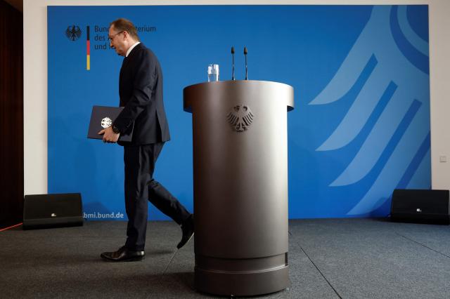 German Interior Minister Alexander Dobrindt leaves after addressing a press conference in Berlin on May 13, 2025, after German authorities launched multiple raids against an extremist network and dissolved the so-called "Kingdom of Germany". The Federal Prosecutor's Office also announced the arrest of four people during the raids, including three founding members of the group. Described as "dangerous extremists" by the ministry, the Kingdom of Germany is part of the German conspiracy movement known as the "Citizens of the Reich", which rejects the legitimacy of the modern German republic. Its members believe in the continued existence of the pre-World War I German Reich. (Photo by Odd ANDERSEN / AFP)