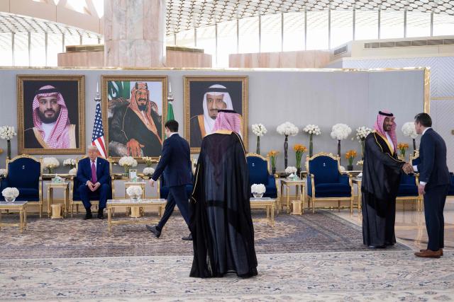 US Secretary of State Marco Rubio walk towards US President Donald Trump (L) as Saudi Crown Prince Mohammed bin Salman welcome US Secretary of Defense Pete Hegseth (R) in Riyadh on May 13, 2025. (Photo by Brendan Smialowski / AFP)