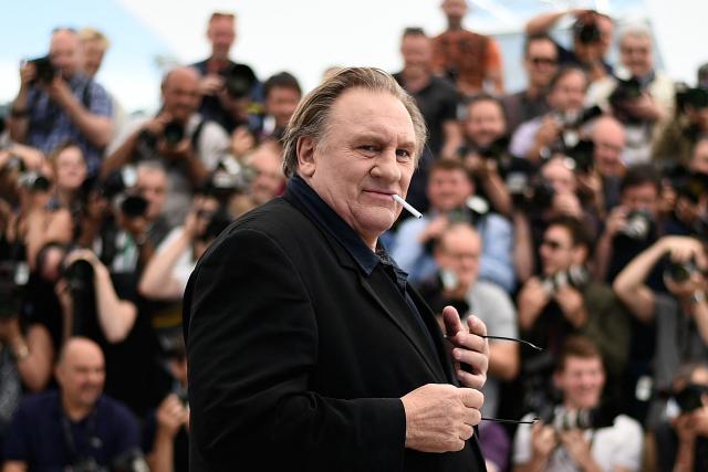 (FILES) French actor Gerard Depardieu poses during a photocall for the film "Valley of Love" at the 68th Cannes Film Festival in Cannes, southeastern France, on May 22, 2015. A Paris court on May 13, 2025 handed French cinema icon Gerard Depardieu an 18-month suspended sentence after convicting him of sexually assaulting two women on a film set in 2021. The Paris court also ordered that Depardieu, 76, who was not present in court for the verdict, be inscribed on the sex offenders' register. (Photo by Loic VENANCE / AFP)