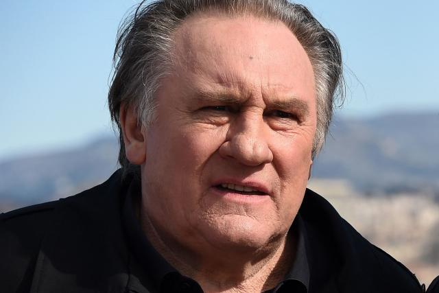 (FILES) French actor Gerard Depardieu poses during a photocall for the second season of the French TV show "Marseille" broadcasted and co-produced by US streaming video giant Netflix, in Marseille, southern France on February 18, 2018. A Paris court on May 13, 2025 handed French cinema icon Gerard Depardieu an 18-month suspended sentence after convicting him of sexually assaulting two women on a film set in 2021. The Paris court also ordered that Depardieu, 76, who was not present in court for the verdict, be inscribed on the sex offenders' register. (Photo by ANNE-CHRISTINE POUJOULAT / AFP)