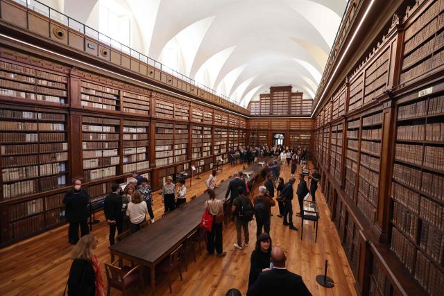 People visit the renovated Fesch municipal library during its re-opening inauguration in Ajaccio on the French Mediterranean island of Corsica, on May 13, 2025. (Photo by Pascal POCHARD-CASABIANCA / AFP)