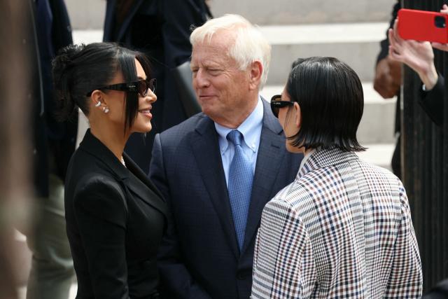 US celebrity Kim Kardashian (L) speaks with her mother Kris Jenner (R) as she arrives at the Assize Court for the trial during which she will testify over the 2016 robbery that saw her relieved of millions of dollars' worth of jewellery at gunpoint in Paris, on May 13, 2025. The trial of this sensational nine million euro jewellery robbery opened in Paris on April 28, 2025. (Photo by Alain JOCARD / AFP)