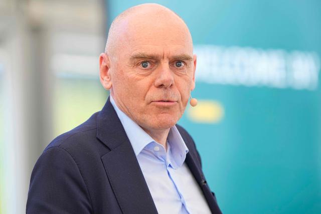 CEO of European Energy AS Knud Erik Andersen (R) delivers a speech during the inauguration of the world's largest commercial e-methanol plant in Aabenraa, Denmark, on May 13, 2025. The Kassoe facility is the first of its kind globally to produce e-methanol at commercial scale. The plant has an annual production capacity of 42, 000 tonnes and operates entirely on renewable energy sources. (Photo by Bo Amstrup / Ritzau Scanpix / AFP) / Denmark OUT