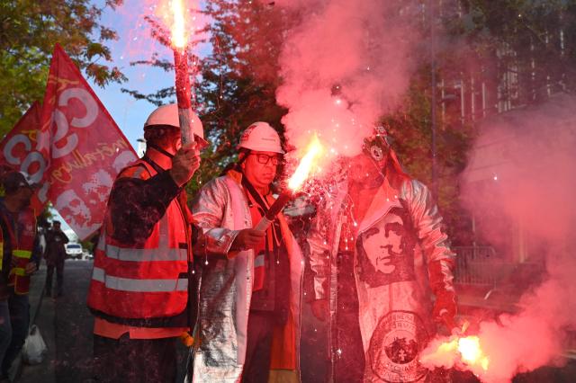 Employees take part in a rally outside ArcelorMittal headquarters to put pressure on the French management of the steelmaker, which is planning to cut more than 600 jobs in Saint-Denis near Paris, on May 13, 2025. (Photo by LEO VIGNAL / AFP)