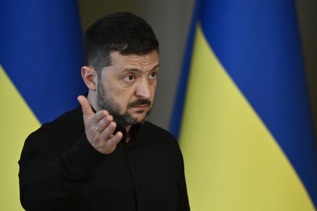 Ukraine's President Volodymyr Zelensky delivers a press conference in Kyiv on May 13, 2025, amid the Russian invasion of Ukraine. Zelensky urged the United States to levy its most hard-hitting package of sanctions on Moscow if Russian President rejects a call to meet in Turkey this week. (Photo by Genya SAVILOV / AFP)