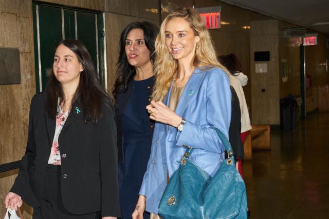 Kaja Sokol (R), an alleged victim of Harvey Weinstein, arrive in Manhattan Criminal Court during Weinstein's rape and sexual assault re-trial in New York on May 13, 2025. The former Miramax studio boss is charged in the New York with the 2006 sexual assault of Miriam Haley and the 2013 rape of Jessica Mann. He also faces a new count for an alleged sexual assault of a 19-year-old in 2006. (Photo by Bing GUAN / POOL / AFP)