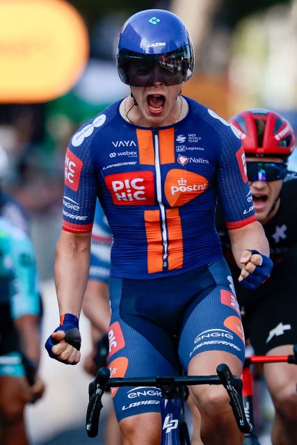 Team Picnic PostNL's Dutch rider Casper Van Uden celebrates as he crosses the finish line of the 4th stage of the 108th Giro d'Italia cycling race 189kms from Alberobello to Lecce on May 13, 2025 (Photo by Luca Bettini / AFP)