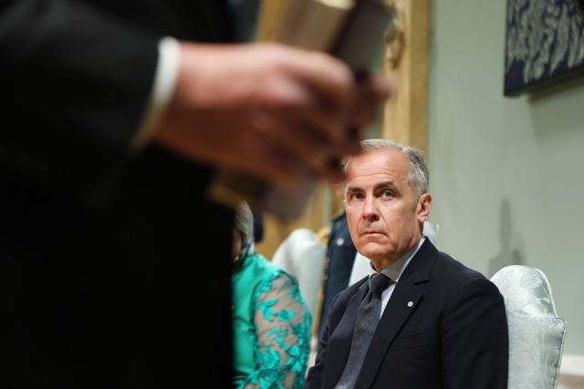 Canadian Prime Minister Mark Carney attends a swearing-in ceremony for members of the Canadian ministry at Rideau Hall in Ottawa, Ontario, Canada, May 13, 2025. Carney and his team will have two weeks to prepare for a new session of parliament, which will be opened by King Charles. Carney's Liberals fell just short of the 172 seats needed for majority control of Parliament, but with 169 confirmed wins they will be in a strong position to pass legislation. (Photo by Dave Chan / AFP)
