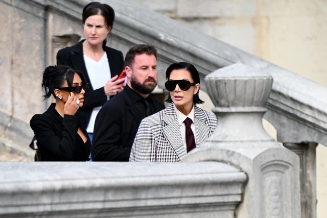 US celebrity Kim Kardashian (L) leaves with her mother Kris Jenner (R) the Assize Court after testifying in a trial over the 2016 robbery that saw her relieved of millions of dollars' worth of jewellery at gunpoint in Paris, on May 13, 2025. The trial of this sensational nine million euro jewellery robbery opened in Paris on April 28, 2025. (Photo by LEO VIGNAL / AFP)