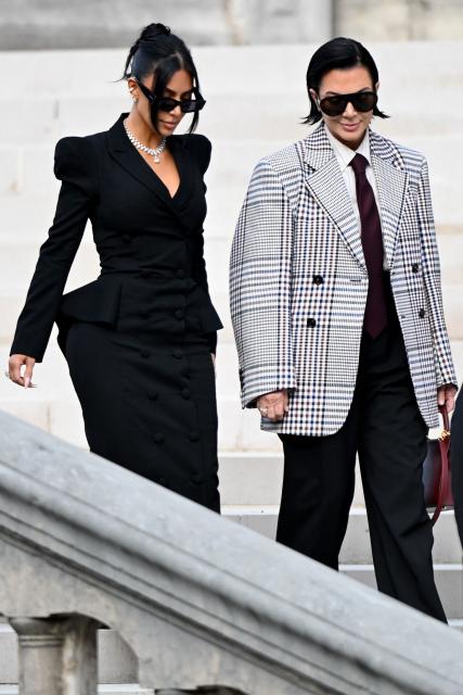 US celebrity Kim Kardashian (L) leaves with her mother Kris Jenner (R) the Assize Court after testifying in a trial over the 2016 robbery that saw her relieved of millions of dollars' worth of jewellery at gunpoint in Paris, on May 13, 2025. The trial of this sensational nine million euro jewellery robbery opened in Paris on April 28, 2025. (Photo by LEO VIGNAL / AFP)
