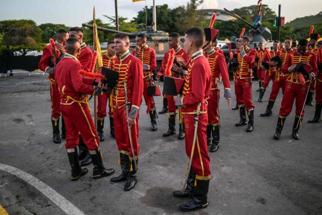 Member's of the Venezuelan Army prepare to take part in a military parade during the Inauguration of Victory Square, commemorating the 80th anniversary of the Soviet Union's victory over Nazi Germany in World War Two (WWII), in Caracas on May, 13, 2025. (Photo by Juan BARRETO / AFP)