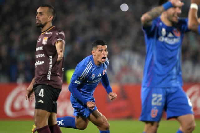 Universidad de Chile's midfielder #08 Israel Poblete celebrates scoring his team's fourth goal fight for the ball during the Copa Libertadores group stage football match between Chile's Universidad de Chile and Venezuela's Carabobo, at the Nacional Julio Martinez Pradanos stadium in Santiago, on May 13, 2025. (Photo by Rodrigo ARANGUA / AFP)