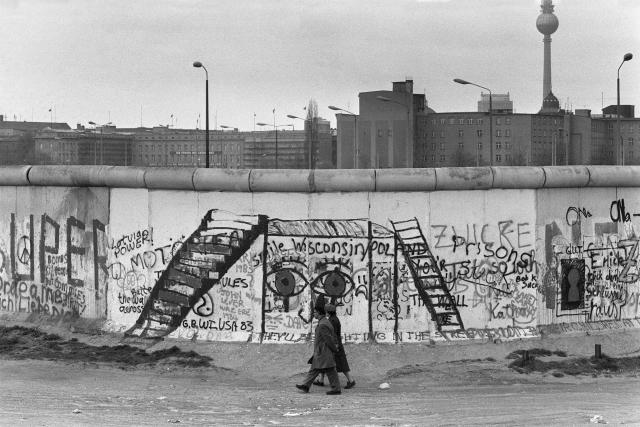 (FILES) Various graffiti are painted on the Berlin Wall on the West Berlin side on April 29, 1984. The Berlin wall built by the East German government to seal off East Berlin from the part of the city occupied by the three main western powers (USA, Great Britain and France), and to prevent mass illegal emigration to the West. The wall, built along the border between German Democratic Republic (GDR) and Federal Republic of Germany, was the scene of the shooting of many East Germans who tried to escape from GDR. The two countries remained divided until November 1989 when the wall was unexpectedly opened following increased pressure for political reform in GDR. Already presented at the beginning of the year in Madrid, an exhibition opening on May 14, 2025 traces through some 200 objects, photographs, documents, films, and testimonies the history of this emblematic wall of the bipolar world resulting from World War II, from its construction to its destruction on November 9, 1989. (Photo by JOEL ROBINE / AFP)