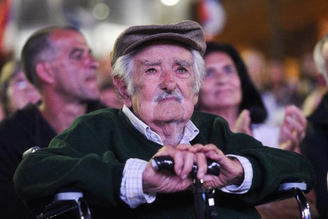 (FILES) Former Uruguayan President Jose Mujica reacts after receiving a tribute during the 54th anniversary of the Frente Amplio political coalition in Montevideo on March 26, 2025. Uruguay's former president (2010-2015) Jose "Pepe" Mujica, a former guerrilla fighter and icon of the left in Latin America, died at the age of 89 on May 13, 2025, the government announced. The farmer dubbed the "world's poorest president" during his presidency for his modest lifestyle had been diagnosed with cancer of the esophagus in May 2024. (Photo by Sofia TORRES / AFP)