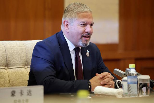 Honduras Foreign Minister Eduardo Enrique Reina attends a meeting with Chinese Foreign Minister Wang Yi (not pictured) at the Diaoyutai State Guesthouse in Beijing on May 14, 2025. (Photo by FLORENCE LO / POOL / AFP)