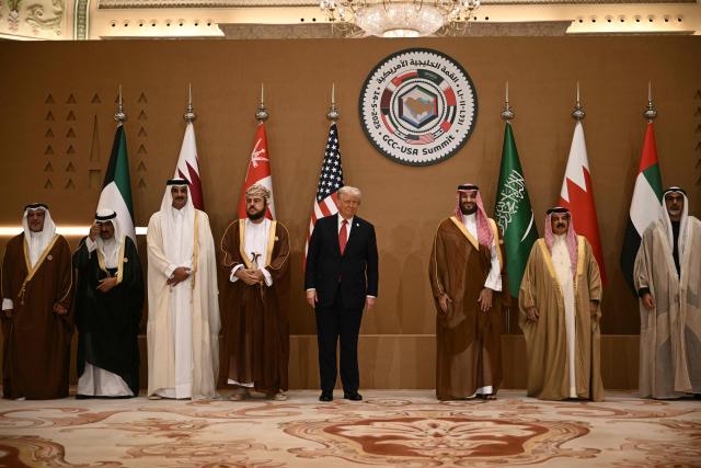 US President Donald Trump poses with Gulf leaders and officials during the Gulf Cooperation Council summit in in Riyadh on May 14, 2025. From L to R: Bahrain's Crown Prince Salman bin Hamad al-Khalifa, the Emir of Kuwait Sheikh Meshal al-Ahmad al-Sabah, Qatar's Emir Sheikh Tamim bin Hamad Al-Thani,'Oman's Deputy Prime Minister Sayyid Asaad Tariq Taimur al-Said, US President Donald Trump, Saudi Crown Prince Mohammed bin Salman, Bahrain's King Hamad bin Isa al-Khalifa and other officials. (Photo by Brendan SMIALOWSKI / AFP)