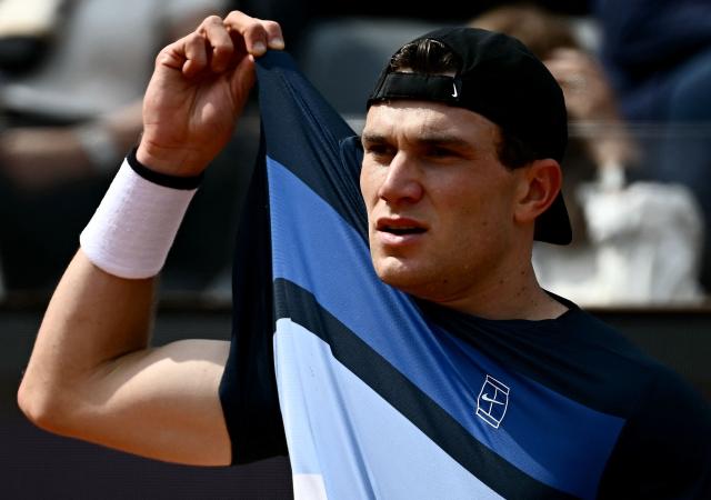Great Britain's Jack Draper reacts after a point against Spain's Carlos Alcaraz during their men's singles match at the ATP Rome Open tennis tournament at Foro Italico in Rome on May 14, 2025. (Photo by Filippo MONTEFORTE / AFP)