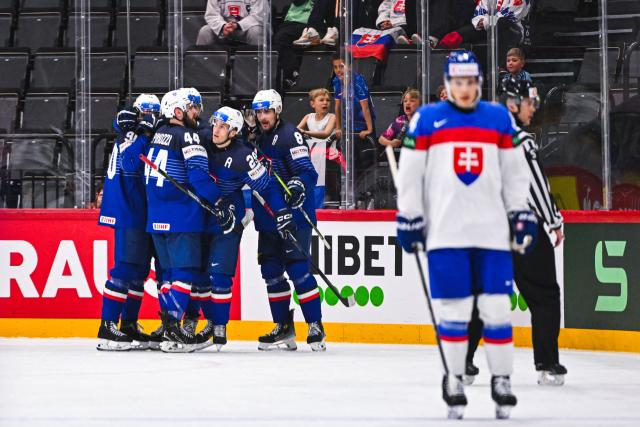 France’s forward #29 Louis Boudon celebrates with his teammates after scoring 1-1 during the IIHF Men's Ice hockey World Championship match between Slovakia and France in Stockholm, on May 14, 2025. (Photo by Jonathan NACKSTRAND / AFP)