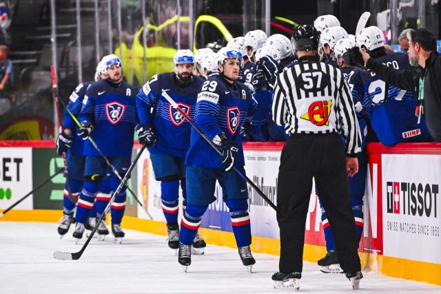 France’s forward #29 Louis Boudon celebrates with his teammates after scoring 1-1 during the IIHF Men's Ice hockey World Championship match between Slovakia and France in Stockholm, on May 14, 2025. (Photo by Jonathan NACKSTRAND / AFP)