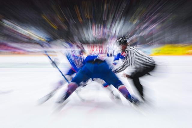 The match referee controls a face-off during the IIHF Men's Ice hockey World Championship match between Slovakia and France in Stockholm, on May 14, 2025. (Photo by Jonathan NACKSTRAND / AFP)