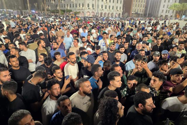 Libyan protesters gather in Tripoli's Martyrs Square to call for the resignation of the national unity government late on May 14, 2025, following renewed clashes in Libya's capital. Fresh gunbattles erupted on May 14 in Tripoli between two powerful armed groups, a day after authorities declared the fighting over. Local state television and residents said the battles eased towards the end of the day. (Photo by AFP)
