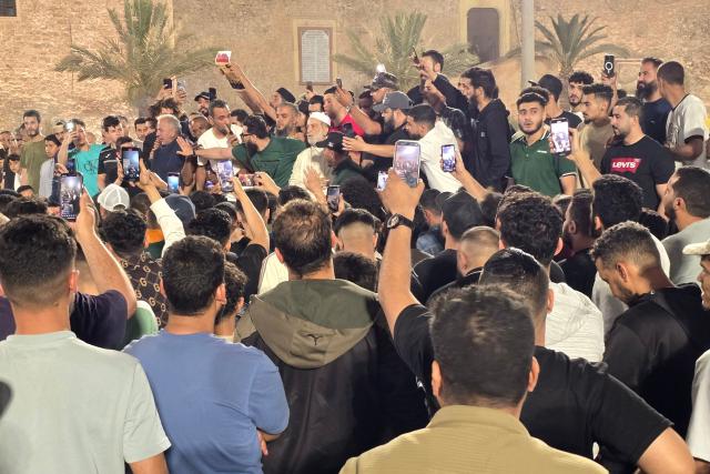 Libyan protesters gather in Tripoli's Martyrs Square to call for the resignation of the national unity government late on May 14, 2025, following renewed clashes in Libya's capital. Fresh gunbattles erupted on May 14 in Tripoli between two powerful armed groups, a day after authorities declared the fighting over. Local state television and residents said the battles eased towards the end of the day. (Photo by AFP)