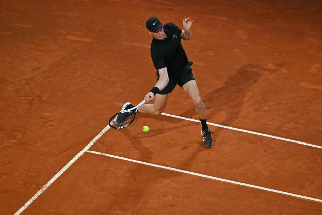Italy's Jannik Sinner returns to Norway's Casper Ruud during their men's singles quarter-final match for the ATP Rome Open tennis tournament at Foro Italico in Rome on May 15, 2025. (Photo by Andreas SOLARO / AFP)