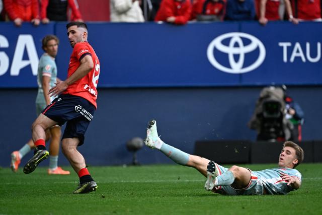 Atletico Madrid's Spanish midfielder #08 Pablo Barrios (R) looks after shooting at goal during the Spanish league football match between CA Osasuna and Club Atletico de Madrid at El Sadar Stadium in Pamplona, on May 15, 2025. (Photo by ANDER GILLENEA / AFP)
