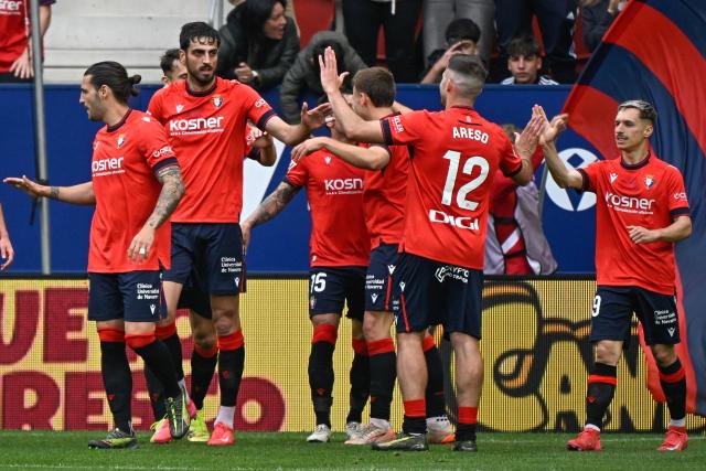 Osasuna's Spanish defender #24 Alejandro Catena (2L) celebrates scoring his team's first goal during the Spanish league football match between CA Osasuna and Club Atletico de Madrid at El Sadar Stadium in Pamplona, on May 15, 2025. (Photo by ANDER GILLENEA / AFP)