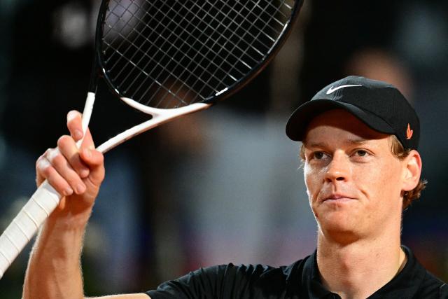 Italy's Jannik Sinner celebrates his victory during his men's singles semi-final match against USA's Tommy Paul for the ATP Rome Open tennis tournament at Foro Italico in Rome on May 16, 2025. (Photo by Tiziana FABI / AFP)