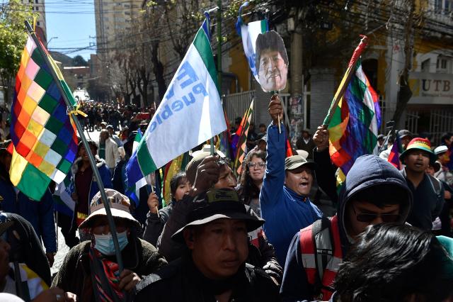 Supporters of Bolivia's former president Evo Morales try to reach the Supreme Electoral Tribunal to demand the registration of their leader as a presidential candidate in La Paz on May 16, 2025. (Photo by JORGE BERNAL / AFP)